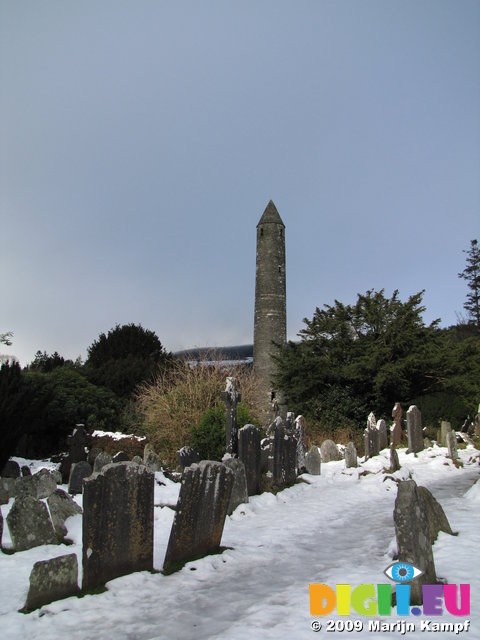 SX02773 Glendalough Round Tower in snow